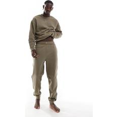 Calvin Klein Green Trousers & Shorts Calvin Klein Tonal Logo Lounge Jogger - Olive/Green