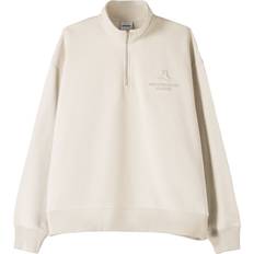 Bershka Beige Tröjor Bershka Gräddvit Sweatshirt Med 1/4-Lång Dragkedja Präglat Tryck - Naturlig