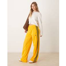 adidas Firebird Loose Track Pant in Crew - Yellow/Collegiate Green