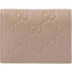 Gucci Wallets & Key Holders Gucci GG Mini Debossed Leather Wallet - Beige