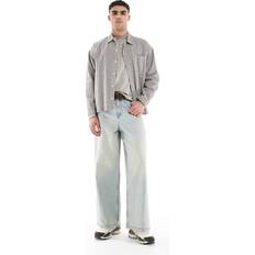 ASOS DESIGN Extra Baggy Jeans Med Vintagetvätt - Ljusblå