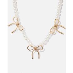 Montini Pärlhalsband guldfärgade rosetter 38+7cm