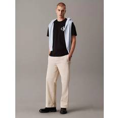 Calvin Klein Black T-shirts Calvin Klein Cotton Relaxed Fit Short Sleeve Varsity T-Shirt - Black
