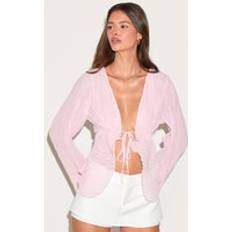 PrettyLittleThing Sheer Plisse Tie Front Flute Sleeve Blouse - Pale Pink