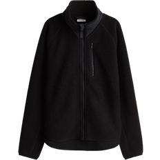 H&M Move Sportjacke aus Teddyfleece - Schwarz