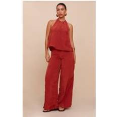 PrettyLittleThing Rust Crinkle Satin Halterneck Overlay Jumpsuit - Orange