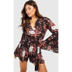 Flare Jumpsuits & Overalls boohoo Womens Floral Flared Sleeve Tie Waist Playsuit - Black