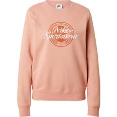 Bruna - Fitness & Gymträning Tröjor Nike Sportswear Sweatshirt Club FLC - Kastanjebrun/Roséguld/Vit