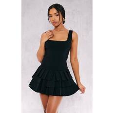 Jumpsuits & Overalls PrettyLittleThing Black Stretch Woven Pleated Skort Playsuit