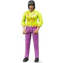 Bruder Figurita Mujer negra con camisa verde y pantalón rosa. Figuras BRU60403