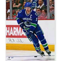 Fanatics Vancouver Canucks Henrik Sedin Autographed Blue Jersey Skating Photograph