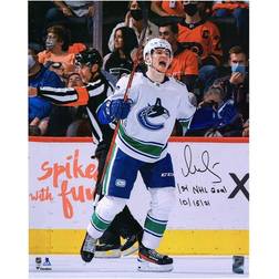 Fanatics Vancouver Canucks Vasily Podkolzin Autographed White Jersey Skating Photograph with 1st NHL Goal 10/15/21 Inscription