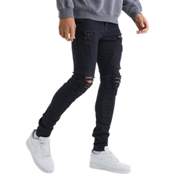 boohooMAN Tall Skinny Jeans With All Over Rips - True Black