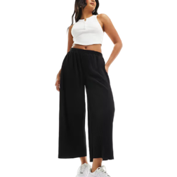 ASOS DESIGN Svarta, plisserade culotte-byxor med vida ben-Svart/a