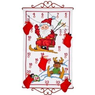 Broderikit Ski-nisse 5125/38 38 x 61 cm Broderi med kors- og stikkesting. Mål: 38x61 cm. Sneen falder blidt over landskabet. Syet på hvid Aida stof, 3,2 tråde/cm. Pakken indeholder ringe, ingen beslag.