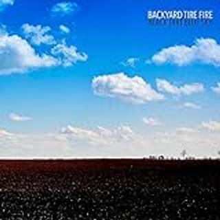 Backyard Tire Fire - Black Dirt Blue Sky