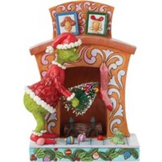 Disney Grinch Stuffing Christmas Tree up Fireplace
