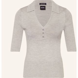 Kortærmet, uldblandet sweater med knapper på stolpen