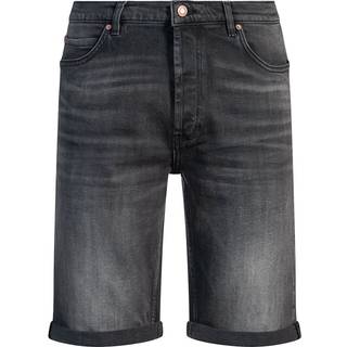 Shorts med indsnævret benvidde i behagelig, sort denim med stræk