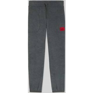 Tracktrousers i fleece i relaxed fit med rød logomærkat