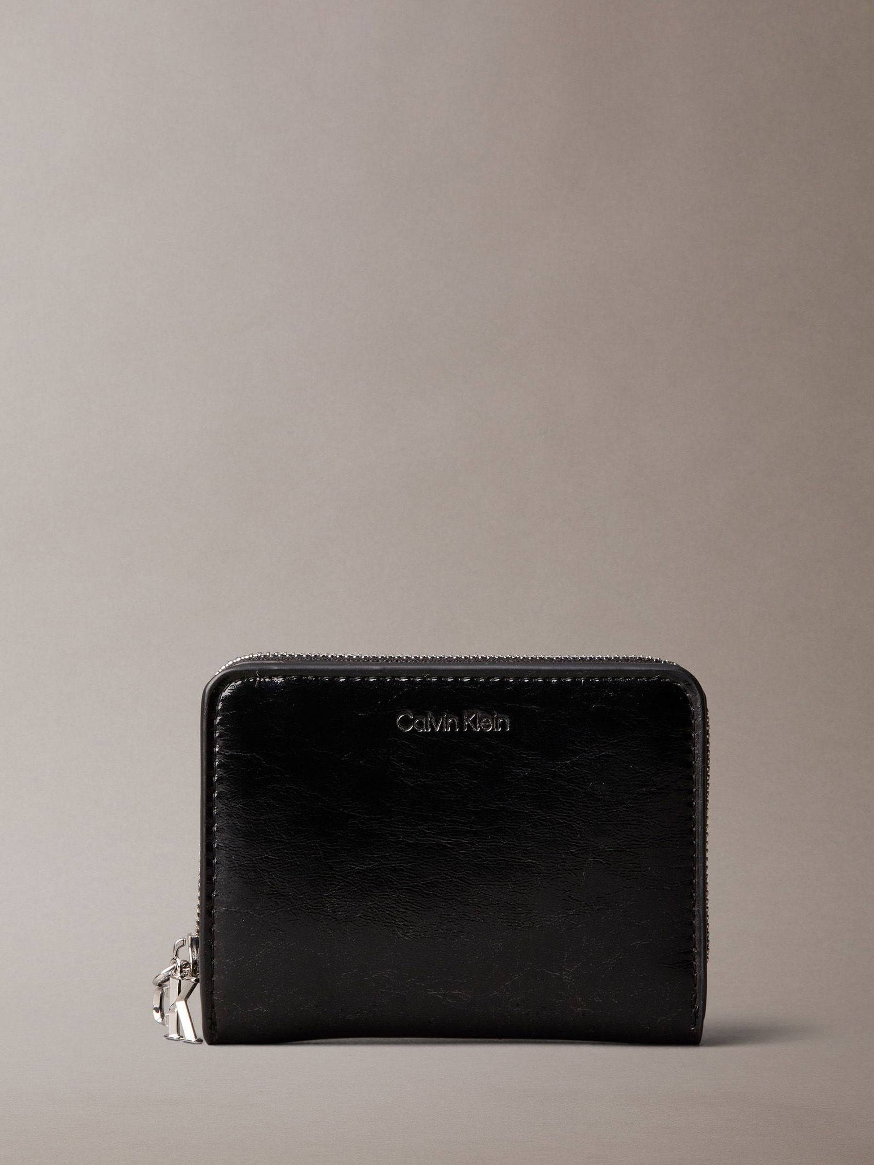 Calvin Klein Embossed Logo Metallic Purse Monogram Zip Wallet