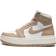 Nike AJ1 Elevate Mid trainers in white and stone