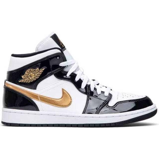 Black fashion white and gold nikes