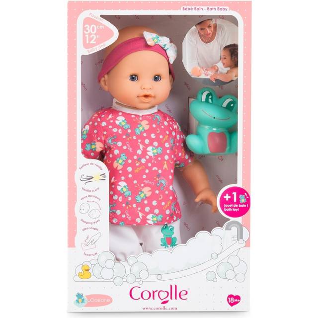 Corolle 9000100510 - Baddocka Oceane - Baddockan Oceane med Mönstrad Tröja, Vita Shorts och Matchande Hårband med Rosett, Vattentät, Badfigur ingår, 30 cm, Från 18 månader