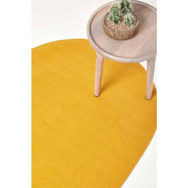 Homescapes Mustard Yellow Handmade Woven Braided Oval Rug, 90 x 150 cm