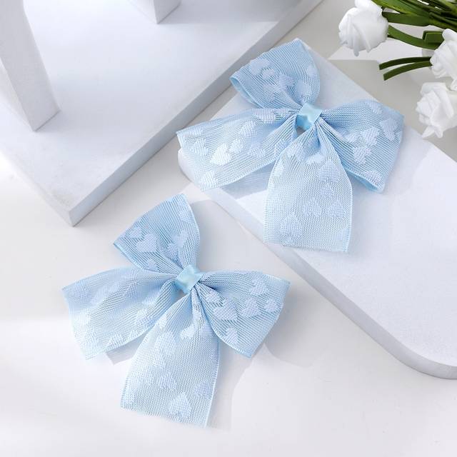 SHEIN 2pcs Toddler Girls Heart Pattern Bow Decor Alligator Hair Clip