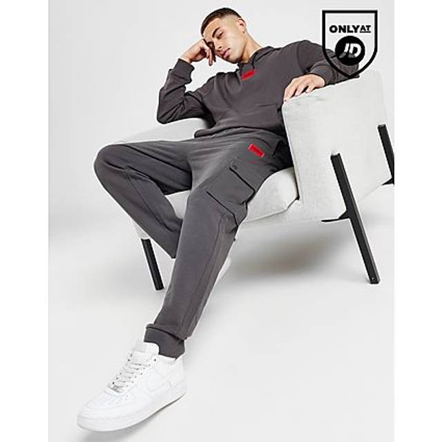 HUGO Dwellrom Relaxed-Fit joggingbyxor för män med röd logotypetikett, Mörkgrå23, M