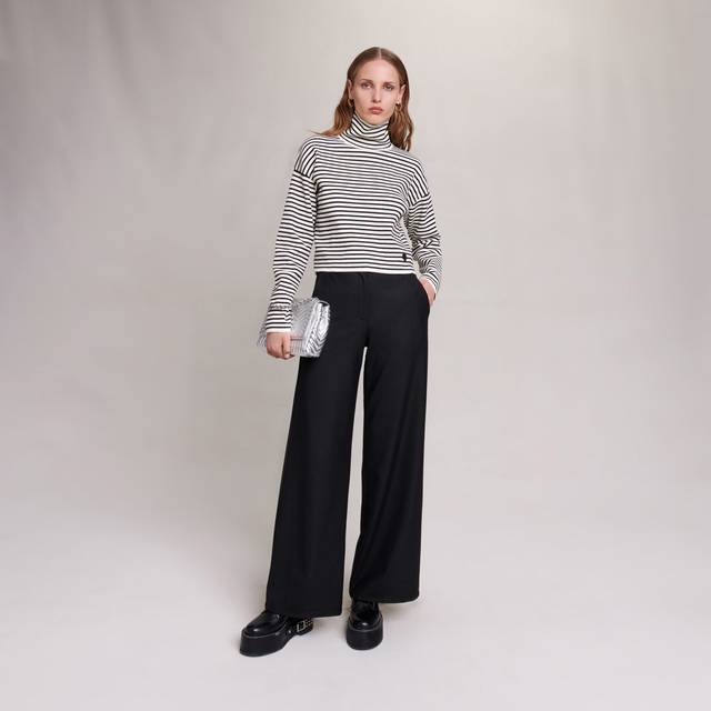 Pimano Flared Trousers - BLACK - Maje gives an everyday classic a contemporary twist with the Pimano trousers. Designed for the modern woman, they're tailored to sit on the waist and fall into a wide, flared leg for a touch of drama. Style with a fitted top and platforms for a stylish edit.