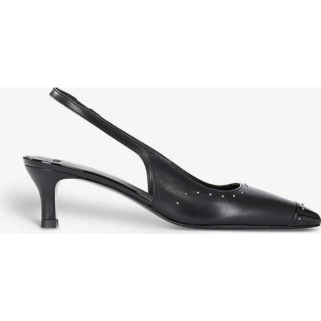 Studded Leather Slingback Pumps - BLA01 - Rock culture, sharp tailoring and Parisian nights are at the core of the DNA that informs French label The Kooples design aesthetic. Founded in 2008 by the Elicha brothers, each collection largely features wardrobe staples including bohemian dresses, outerwear and everyday basics, that are finished with sleek details offering an edgy aesthetic that the brand is known for.