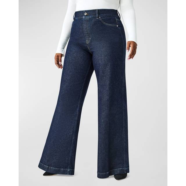 High-Rise Wide Leg Jeans - Raw Indigo - Crafted from premium, stretch denim designed to hug your curves, these Spanx jeans are engineered with built-in targeted technology that shapes your waist. Plus, with a wide leg style featuring a seamed front, these jeans elongate your leg and celebrate your figure. All you have to do is pull these on: no zippers, no buttons, no hip pockets (so no bulk!). This is denim done right.