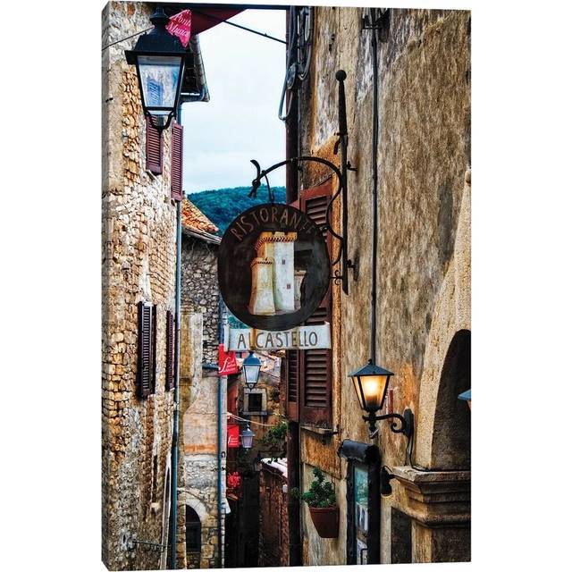 Narrow Medieval Street with Signs and Lamps, Sermoneta, Italy by George Oze - Wrapped Canvas Painting (30.48cm H x 20.32cm W x 1.905cm D)