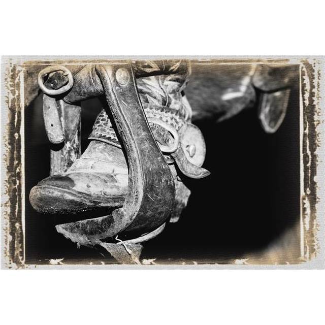 A Black & White Photo of A Cowboy Boot & Stirrup Poster Print by Carson Ganci, 34 x 22 - Large