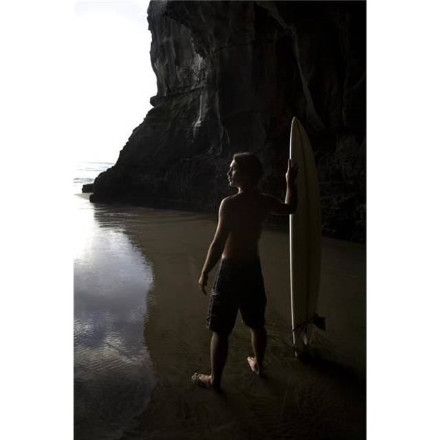 Surfer At Muriwai New Zealand Poster Print by Deddeda, 22 x 34 - Large