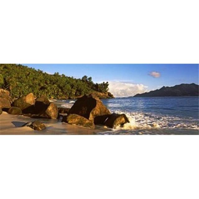 Waves splashing onto rocks on North Island with Silhouette Island in the background  Seychelles Poster Print by  - 36 x 12