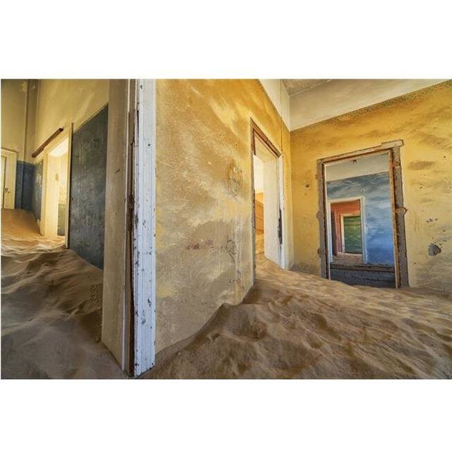 Drifting Sand Fills The Rooms of A Colourful Abandoned House - Kolmanskop Namibia Poster Print - 19 x 12 in.