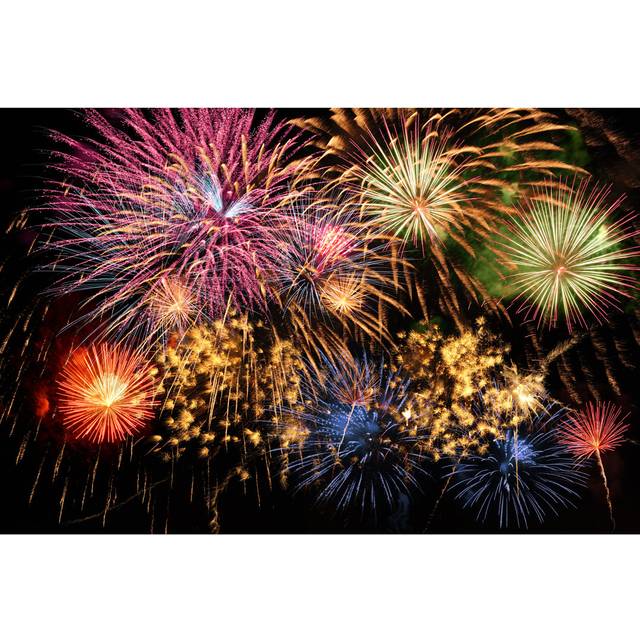 Many Colored Fireworks in the Night Sky by Ginos Photos - Wrapped Canvas Photograph (30cm H x 46cm W x 3.8cm D)