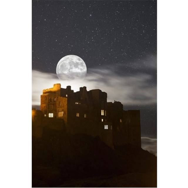 Full Moon Glowing in a Starry Sky Over Illuminated Buildings - Bamburgh Northumberland England Poster Print by John Short, 24 x 38 - Large