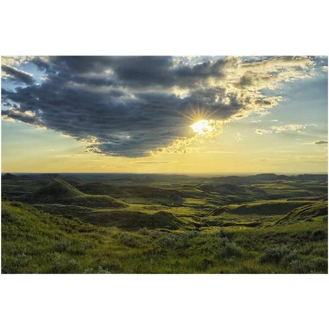 The Sun Shines Through A Cloud Over The Killdeer Badlands Grasslands National Park - Saskatchewan Canada Poster Print - 38 x 24 in. - Large