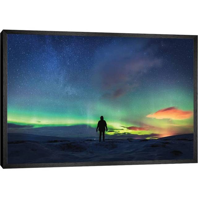 Silhouetted Man with Aurora Northern Lights by James Vodicka - Graphic Art Print on Canvas - Black Framed (45.72cm H x 66.04cm W x 3.81cm D)