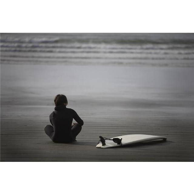 Surfer Sitting On Beach Cox Bay Near Tofino British Columbia Canada Poster Print by Deddeda, 34 x 22 - Large