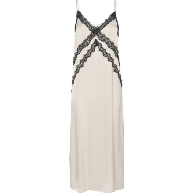 Sachi Embellished Slip Dress - Birch - Founded in 2008 by Sanne Sehested, Gestuz is a contemporary Danish fashion brand known for its effortlessly chic and modern aesthetic. The label seamlessly blends Scandinavian minimalism with bold, vintage-inspired designs to create pieces that are both timeless and on-trend. Whether it's sleek tailoring, statement outerwear, or everyday essentials, you are sure to find something that will portray your individuality with confidence and style.
