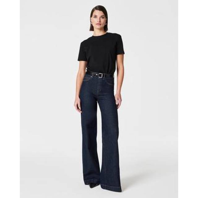 High-Rise Wide Leg Jeans - Raw Indigo - Crafted from premium, stretch denim designed to hug your curves, these Spanx jeans are engineered with built-in targeted technology that shapes your waist. Plus, with a wide leg style featuring a seamed front, these jeans elongate your leg and celebrate your figure. All you have to do is pull these on: no zippers, no buttons, no hip pockets (so no bulk!). This is denim done right.