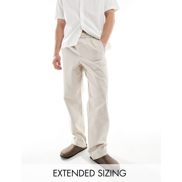ASOS DESIGN – Sandfärgade, baggy byxor med resårmidja-Naturlig