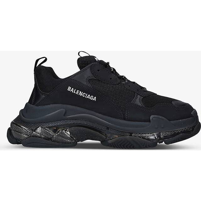 Triple S Clear Sole Trainer - Black - The trainers of the moment from Balenciaga, the chunky composition of the Triple S Trainers has seen the shoe style achieve cult status. Designed with tonal panels with a padded leather heel tab, logo-jacquard tongue, and textured-rubber panel on the sole. Wear yours to lend a directional twist to everyday dressing.
