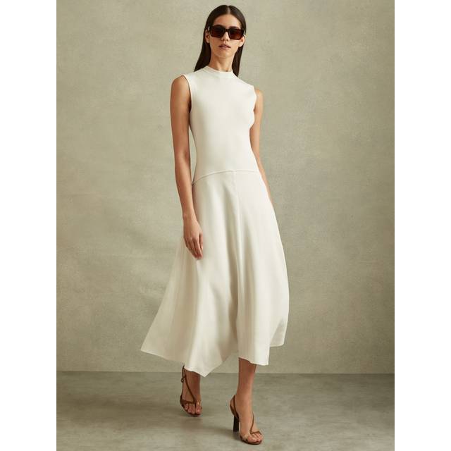 Lani Hybrid-Knit Dress - IVORY - Beginning with men's tailoring in 1970's London, Reiss' design philosophy has endured for over five decades, maintaining the distinctive tailoring, sharp cuts, and contemporary prints it has become famous for to create investment pieces destined to stay in your wardrobe for seasons to come.