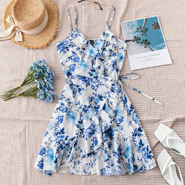 Soleia Women&#39;s Casual Beach Vacation Mini Dress In White With Blue Botanical Floral Print, Asymmetrical Hemline, Side Tie And Ruffle Trim Design - Perfect Fo